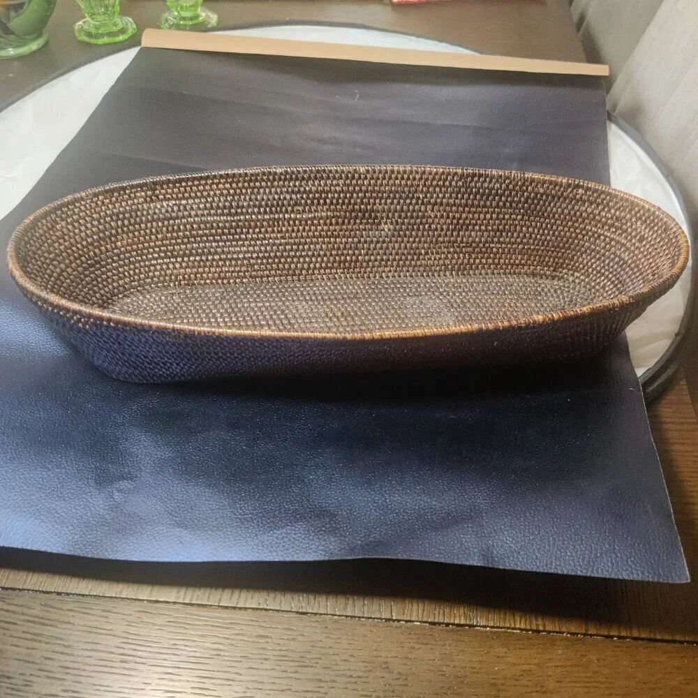 Woven bread basket is long and rectangular oval shape. The weave is exceptional